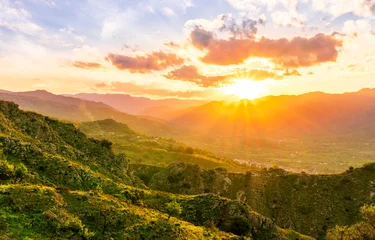 Tuinposter green highland mountain landscape of beutiful sunset or sunrise in greeen summer rural land © Yaroslav