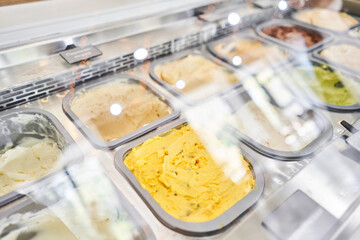 A variety of sugar-free vegan ice cream with natural ingredients on display at the gelateria. Flavors various ice cream in Rome, Italy. Italian gelateria. Natural fresh ice cream.