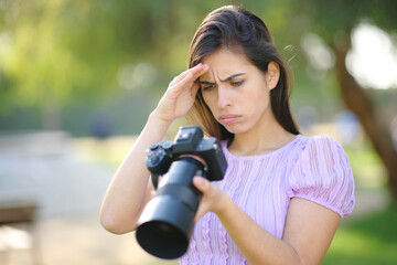 Worried photographer checking photoshoot result