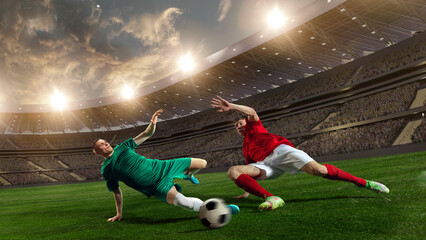 Professional male sportsmen, football, soccer athletes during game at 3D stadium with flashlights. Blurred audience on background. Concept of professional sport, championship, game, achievement