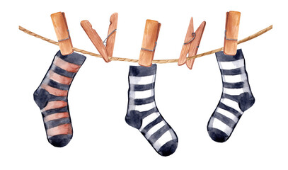 Watercolor striped socks are dried on a rope. Wooden clothespins. Horizontal banner for halloween