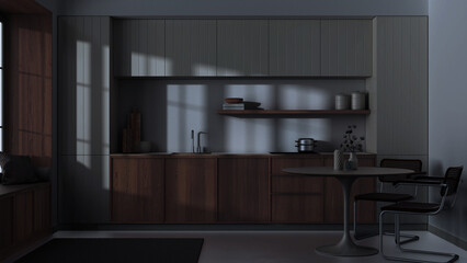 Japandi trendy wooden kitchen and dining room. Wooden cabinets, table and marble top. Minimalist interior design. Dark late evening scene