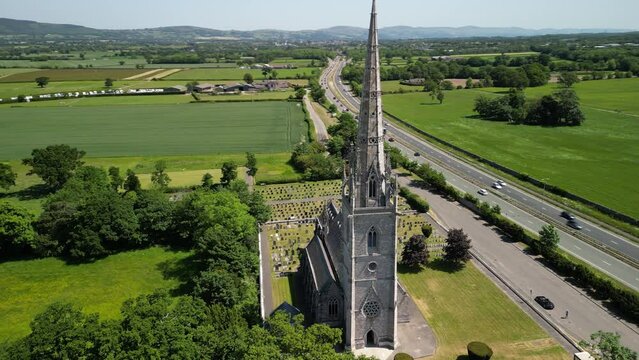 The Marble Church, Bodelwyddan, Wales - Neo-Gothic, aerial drone anti-clockwise pan, move in and focus on steeple  - June 23