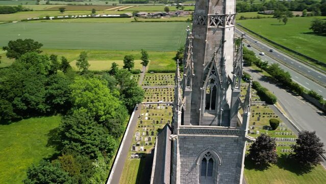 The Marble Church, Bodelwyddan, Wales - Neo-Gothic, ariel drone anti-clockwise pan, in close, focus on steeple, move out and reveal church  - June 23