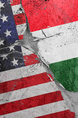 Illustration of the crack between the flags of the United States and Hungary, the concept of a global crisis in political and economic relations
