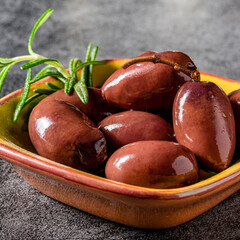 Greek olives in a bowl. Macro shot.