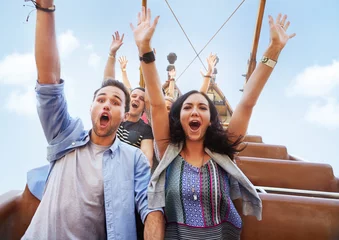 Foto op Plexiglas Portrait enthusiastic friends cheering on amusement park ride © KOTO