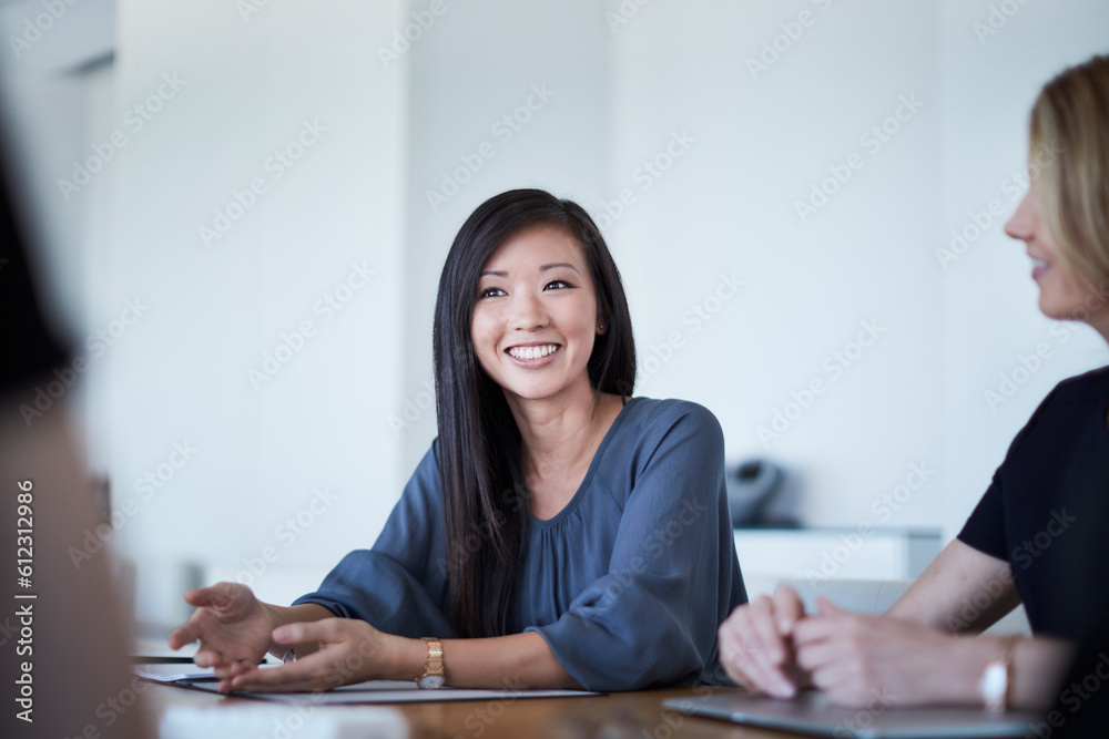 Poster smiling businesswoman in meeting