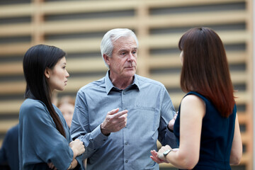 Business people talking in lobby