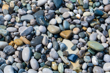 Multi-colored stones on the seashore