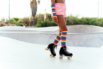 Beautiful woman skating with roller skates and having fun.