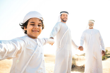Three generation family making a safari in the desert of Dubai