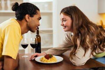 Modern multiethnic unstereotyped couple lifestyle moments at home.