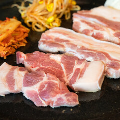 Fresh and delicious iron pan-fried black pork meal in Jeju Korean restaurant.