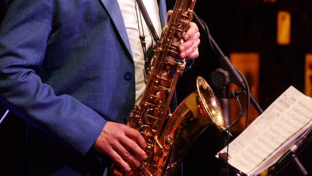 Person playing saxophone in concert
