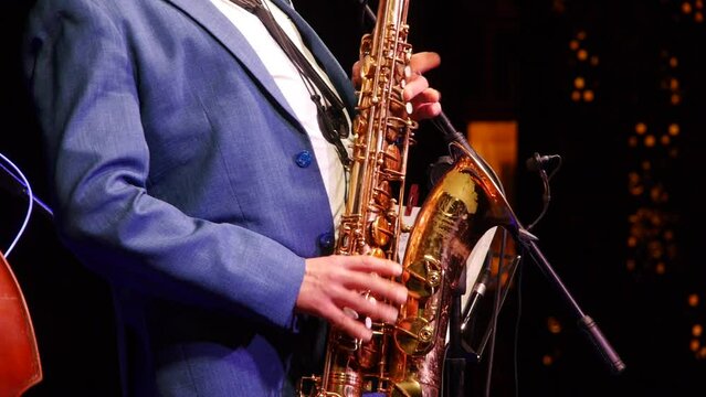 Playing saxophone in concert
