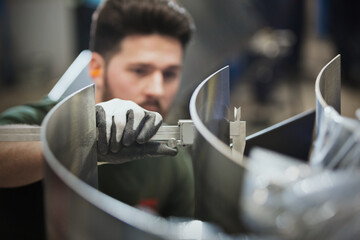 Worker measuring steel with calipers in steel factory - obrazy, fototapety, plakaty