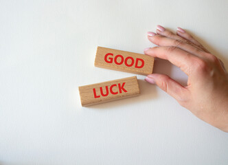 Good luck symbol. Wooden blocks with words Good luck. Businessman hand. Beautiful white background. Business and Good luck concept. Copy space.