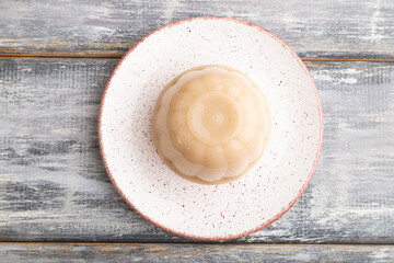 Buckwheat milk jelly on gray wooden, top view.