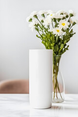 Modern White Tumbler Mockup with Flower Vases in Boho Studio: Contemporary Drinkware Image