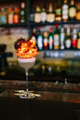 alcoholic cocktail in a glass stands on a table in a bar or restaurant