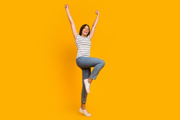 Fototapeta na wymiar Full length body photo view of pretty cheerful carefree girl having fun dancing isolated over bright shine color background