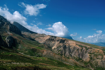 Fototapeta premium Mountain valley with blue sky and clouds