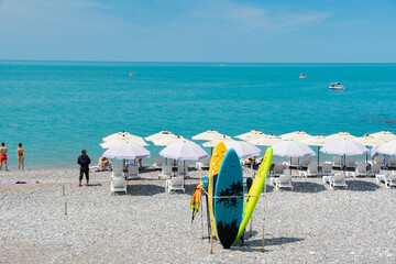 Abkhazia Gagra 06.06.2023 The city beach with sun loungers and umbrellas is ready to receive vacationers
