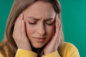 Pretty woman is suffered headache. Migraine, massages temples, magnetic storms