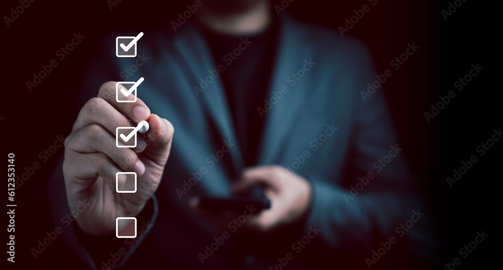 Aufkleber Businessman use pen to tick correct sign mark in checkbox for quality document control checklist and business approve project concept.