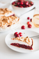 Plate with tasty cherry pie on white background. Top view. Front view