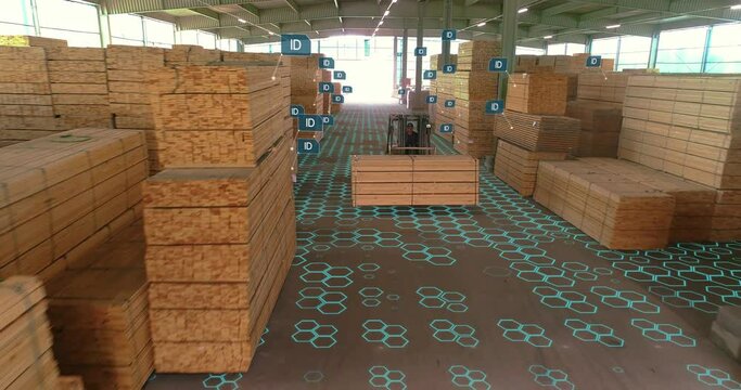 Artificial intelligence in a lumber yard. Modern technologies at the lumber factory. A forklift rides over a lumber pile.