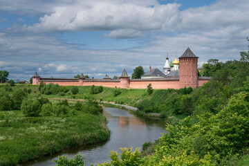 View of the Spaso-Evfimiev Monastery (a monastery of the Vladimir Diocese of the Russian Orthodox Church) on the bank of the Kamenka River on a sunny summer day, Suzdal, Vladimir region, Russia