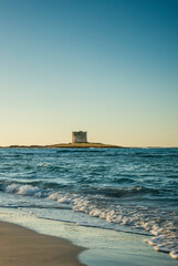 Stintino tower in Pelosa beach in Sardinia, Italy