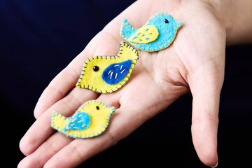 Three handmade brooches embroidered with thread on felt in the form of birds and in Ukrainian...