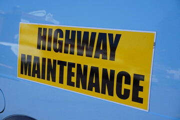 Highway Maintenance sign on side of works van. 