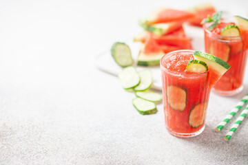 Refreshing cold summer drink watermelon slushie  with cucumber slices in glass