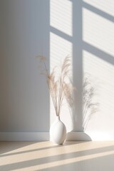 Earthy colored stone table vase with cotton branch leaf natural plant and simple white wall with sun shadows. Minimal scandinavian home decor concept idea. Generated AI.