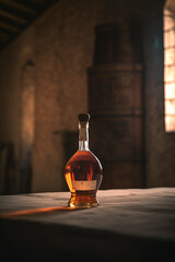 Aged golden fortified wine in the bottle on background of wooden barrels in cellar of winery. AI generated.