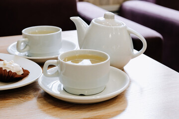 Cups of tea on a table in a cafe. Tea ceremony.