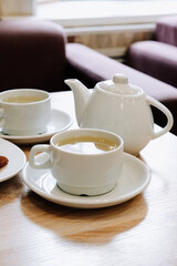 Fototapeta na wymiar Cups of tea on a table in a cafe. Tea ceremony.