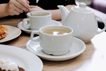 Fototapeta na wymiar Cups of tea on a table in a cafe. Tea ceremony.