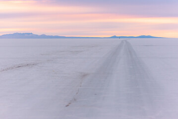 Dawn in the road inside the salt flats of Uyuni