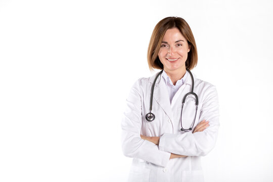 Young attractive female doctor standing with crossed arms and smiling isolated on white background	