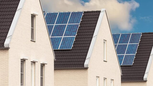Horizontal pan of newly built Dutch houses with solar panels attached to the roof