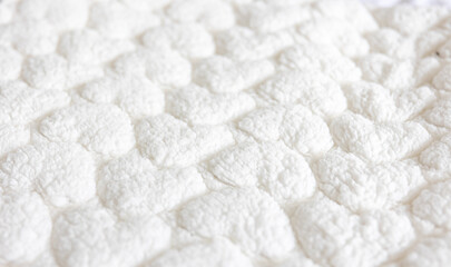 Fototapeta na wymiar Close up white texture of baby blanket.
