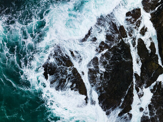 Seashore aerial view,Bird eye view photo of crashing waves on rocks beautiful water surface texture,Dark sea background,Beautiful nature seascape,Amazing view sea background