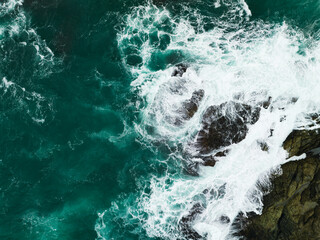 Obraz premium Top view Seashore cliff at Phuket Thailand, beautiful waves crashing on rocks seacoast in open sea summer landscape seascape,Nature environment and Travel background