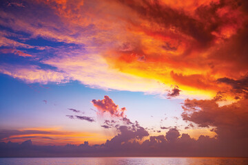 Fototapeta na wymiar Landscape Long exposure of majestic clouds in the sky sunset or sunrise over sea with reflection in the tropical sea.Beautiful cloudscape scenery.Amazing light of nature Landscape nature background