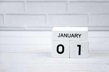 White wooden perpetual calendar showing the 1st of January.